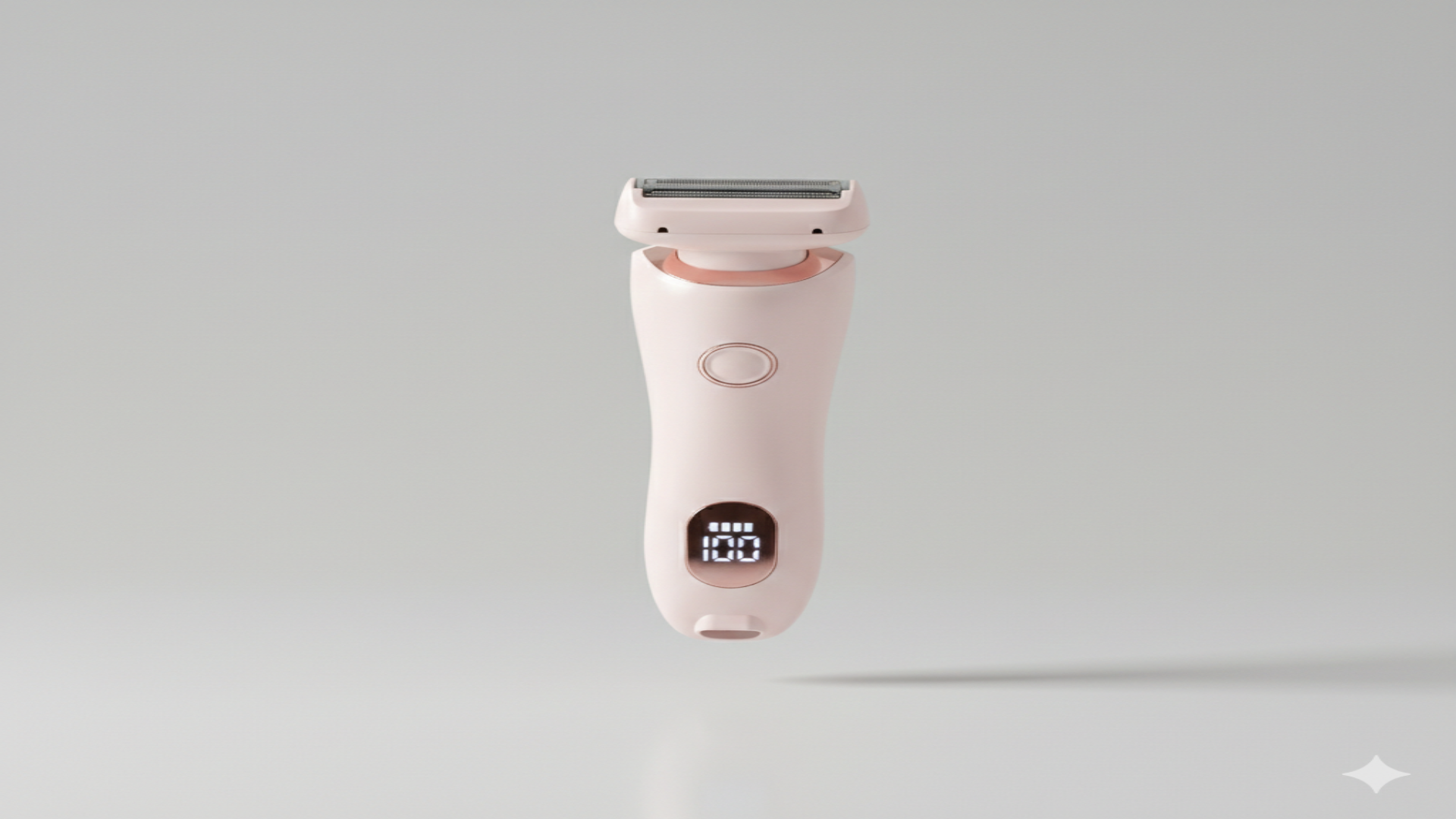 Pink electric shaver on a light gray background